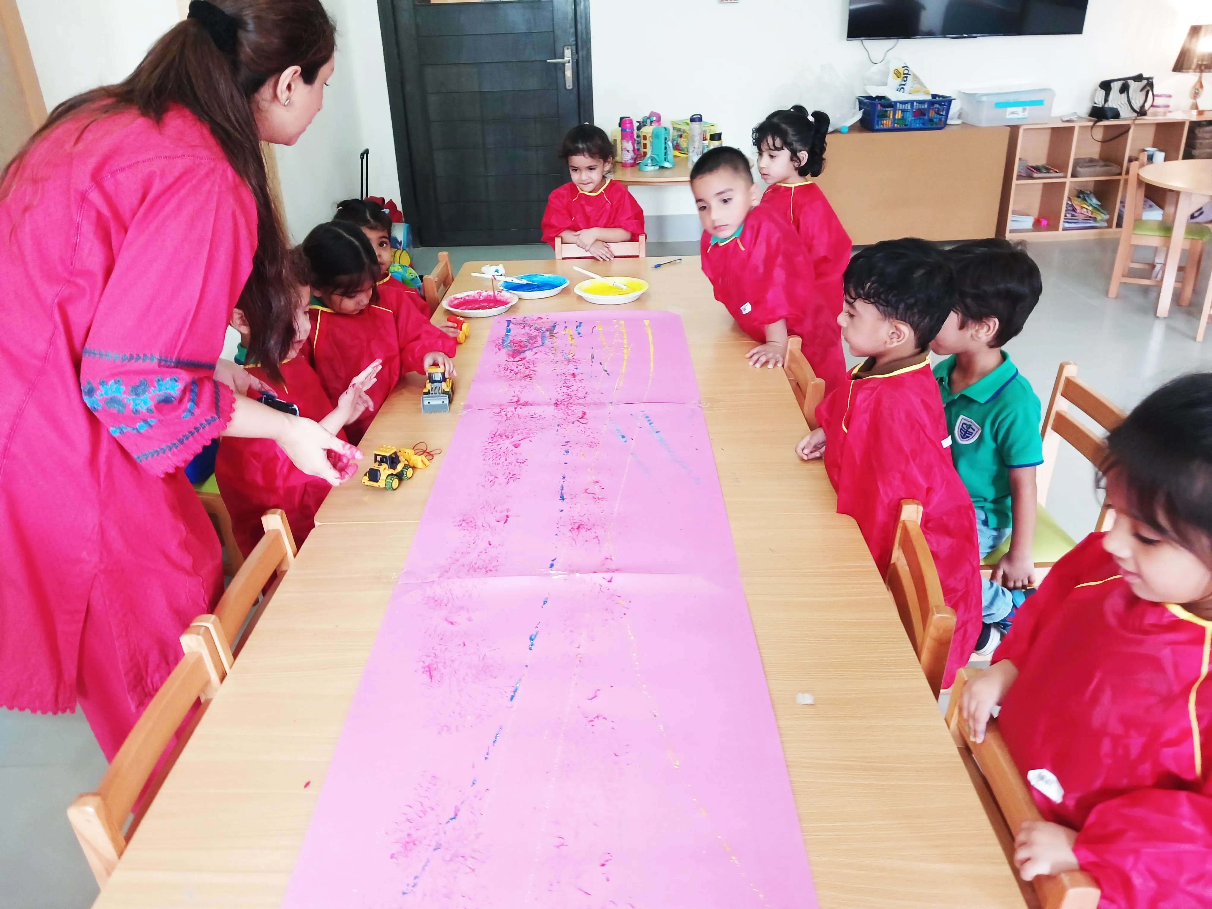 Children exploring a learning activity at CSI Robins